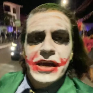 a latin american man in joker makeup